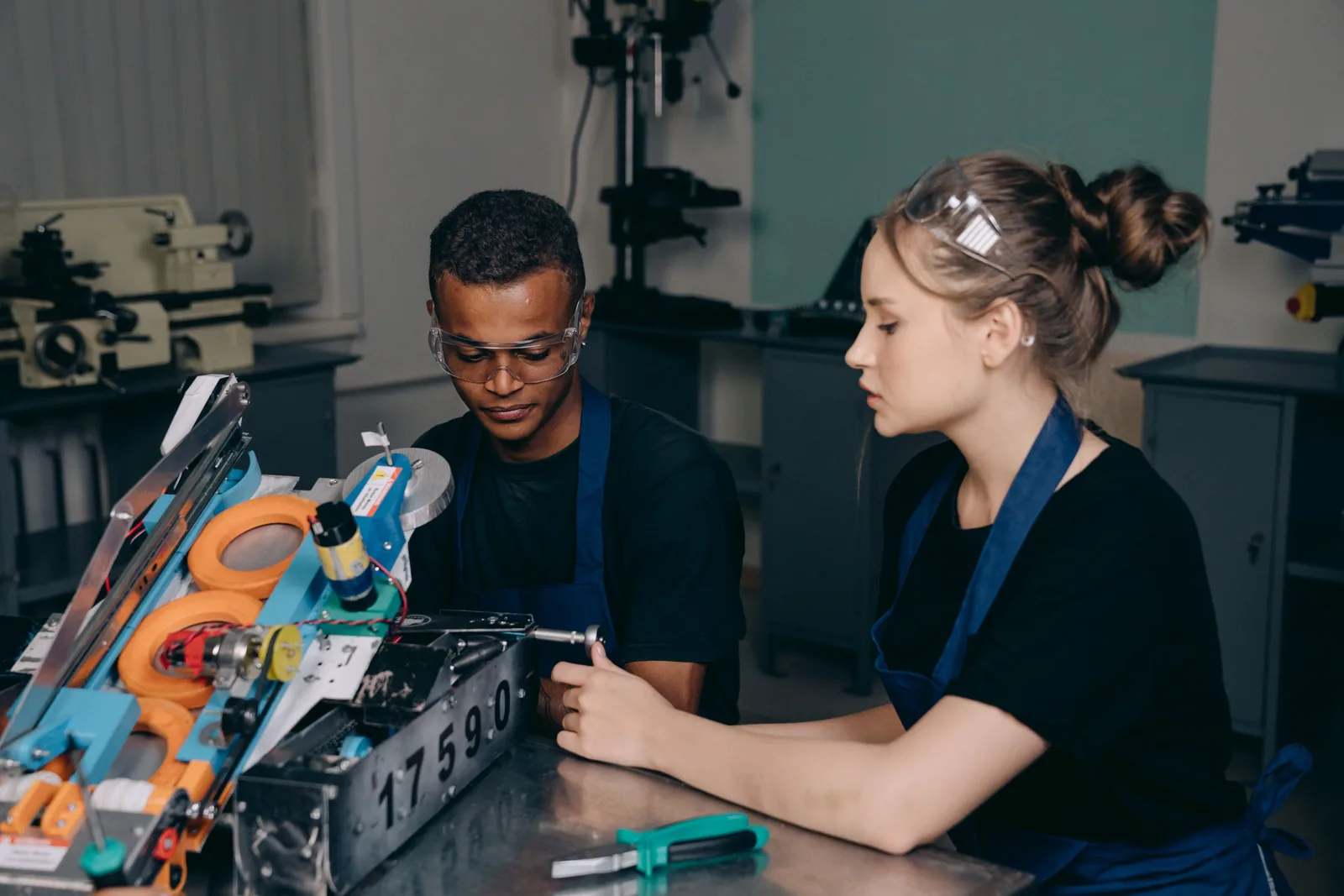 Engineering students collaborating in a practical technical workshop