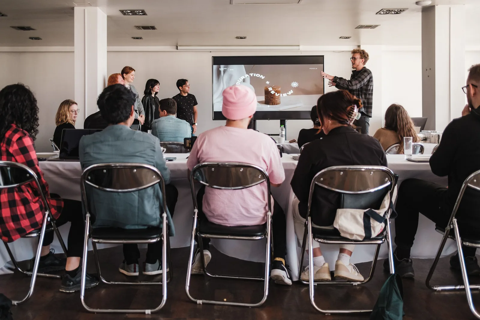 A trainer presenting to an adult workshop audience