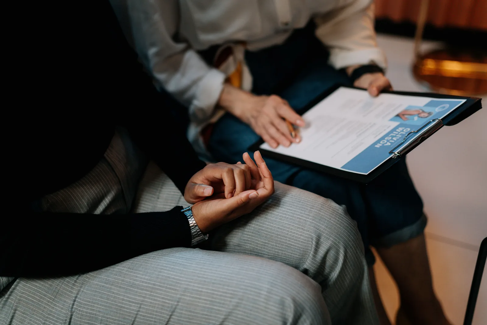 Professionals reviewing a resume during a placement consultation