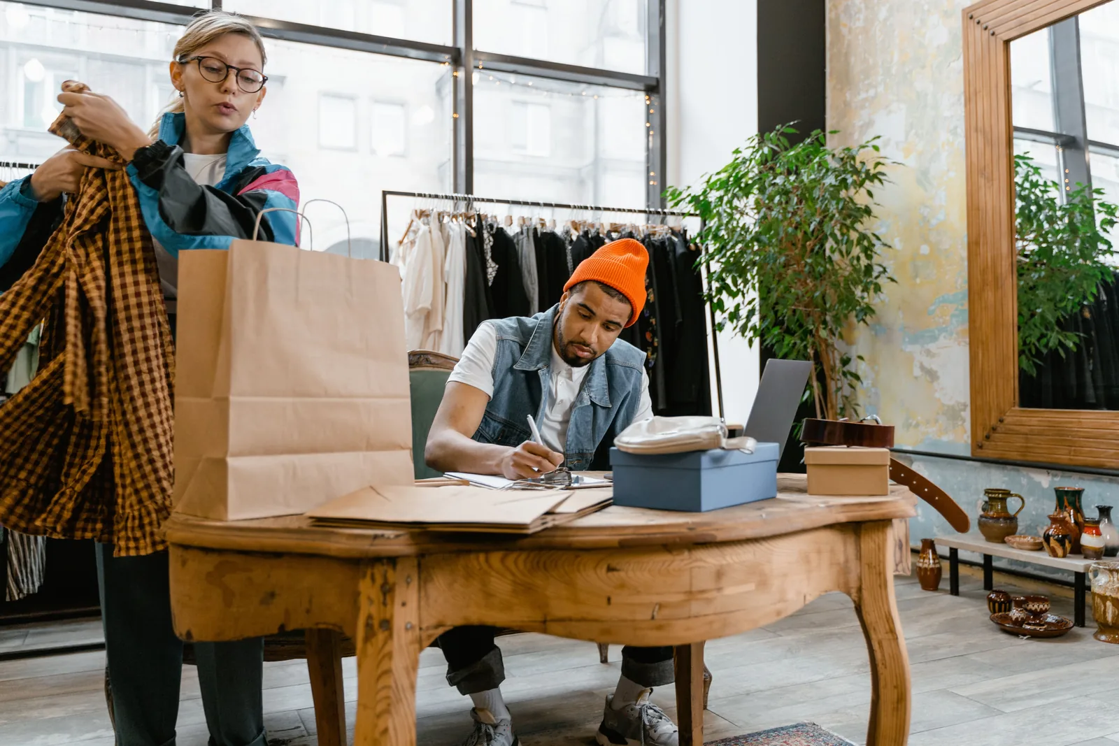 Retail staff working in a clothing store